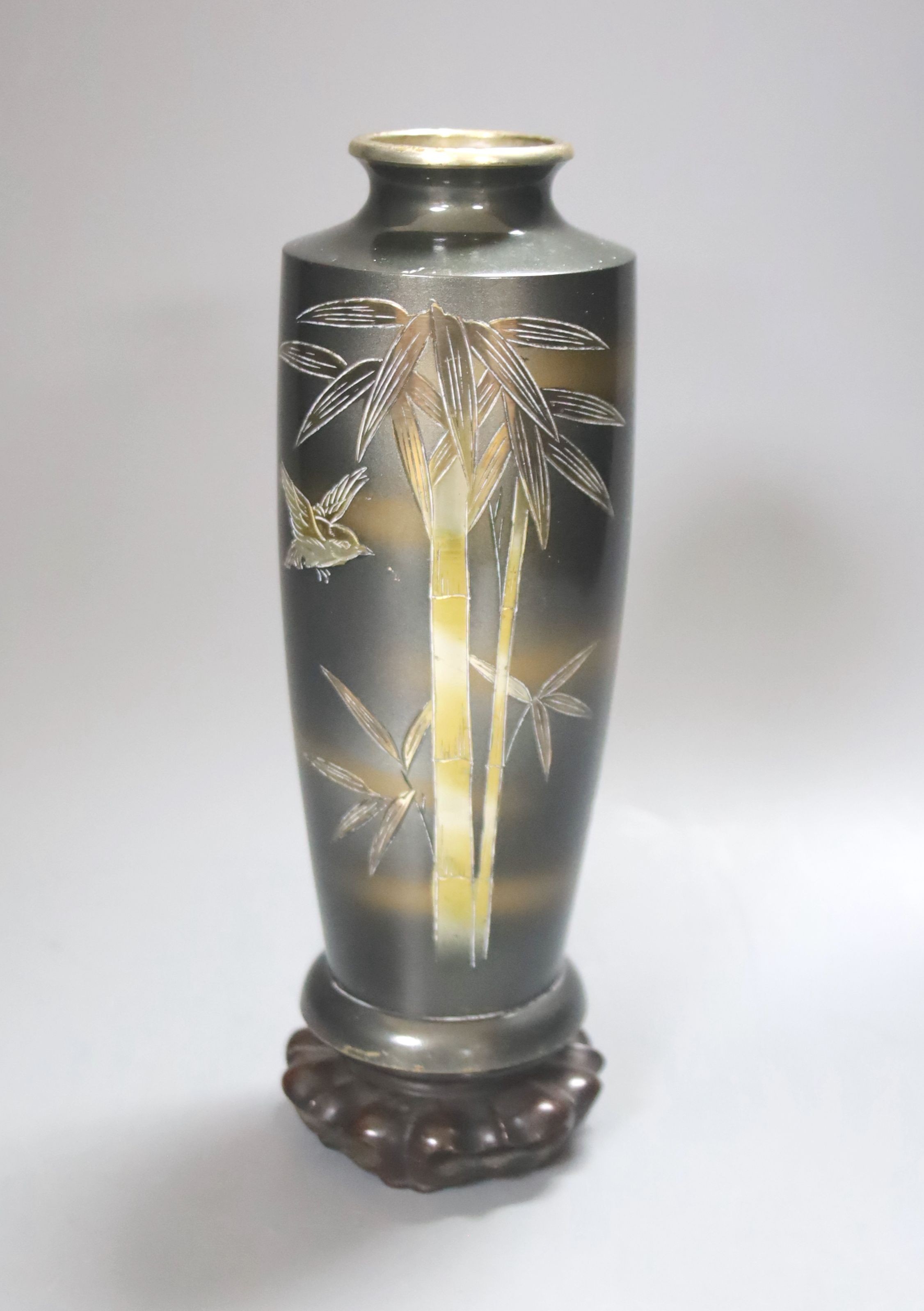 An early 20th century Japanese patinated bronze ‘bamboo’ vase, 18cm, wood stand